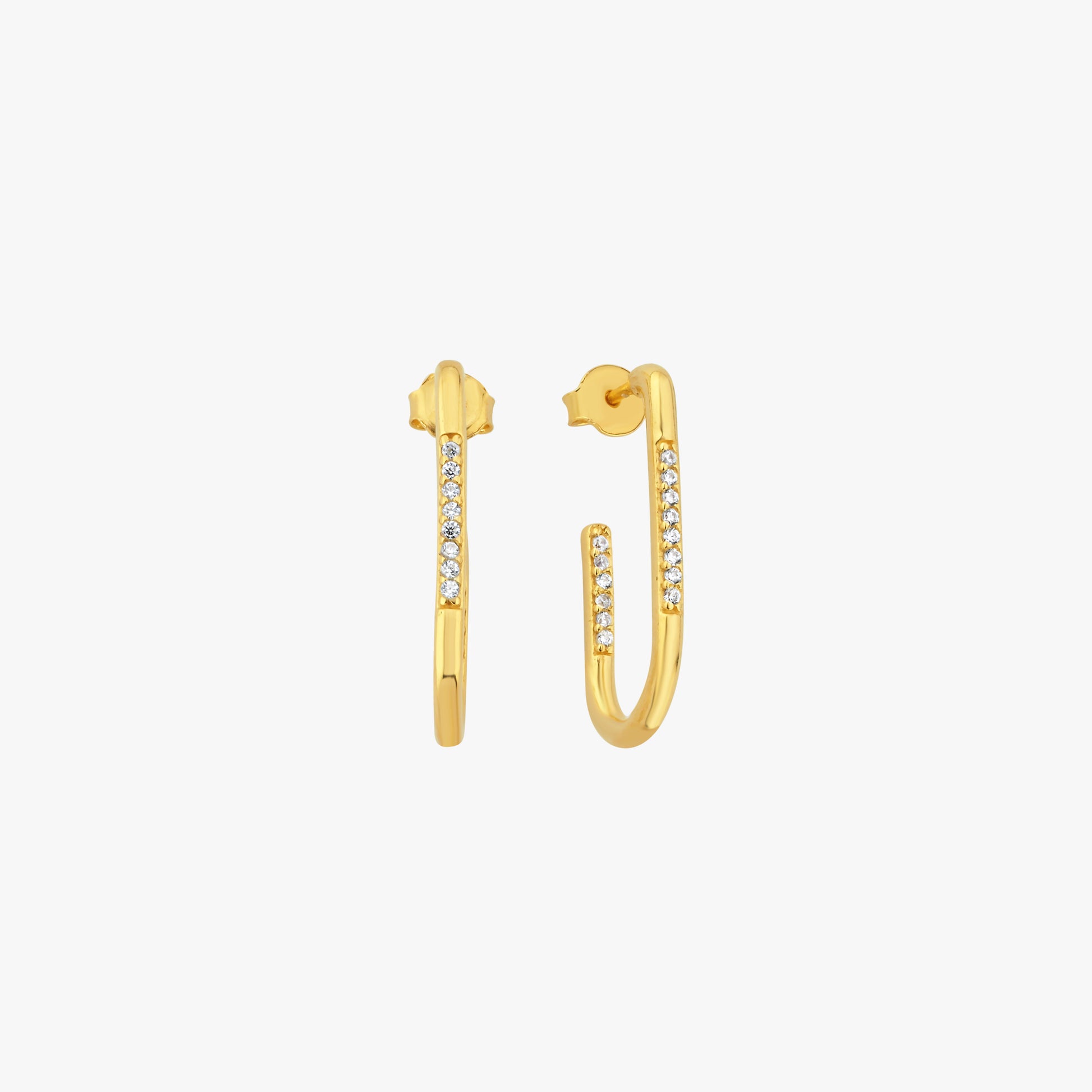 Elegant gold U-shaped hoop earrings featuring sparkling cubic zirconia accents. These modern and sophisticated earrings are crafted with a sleek gold-tone finish, making them a perfect choice for both casual and formal occasions. Designed with a secure push-back closure for comfortable wear.