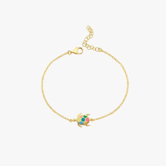 Gold chain bracelet with colorful turtle charm, minimalist design, adjustable clasp, perfect for elegant fashion accessory.
