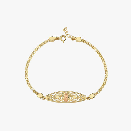 A close-up of the 14K solid gold Virgen de Guadalupe bracelet, emphasizing its detailed filigree pattern.