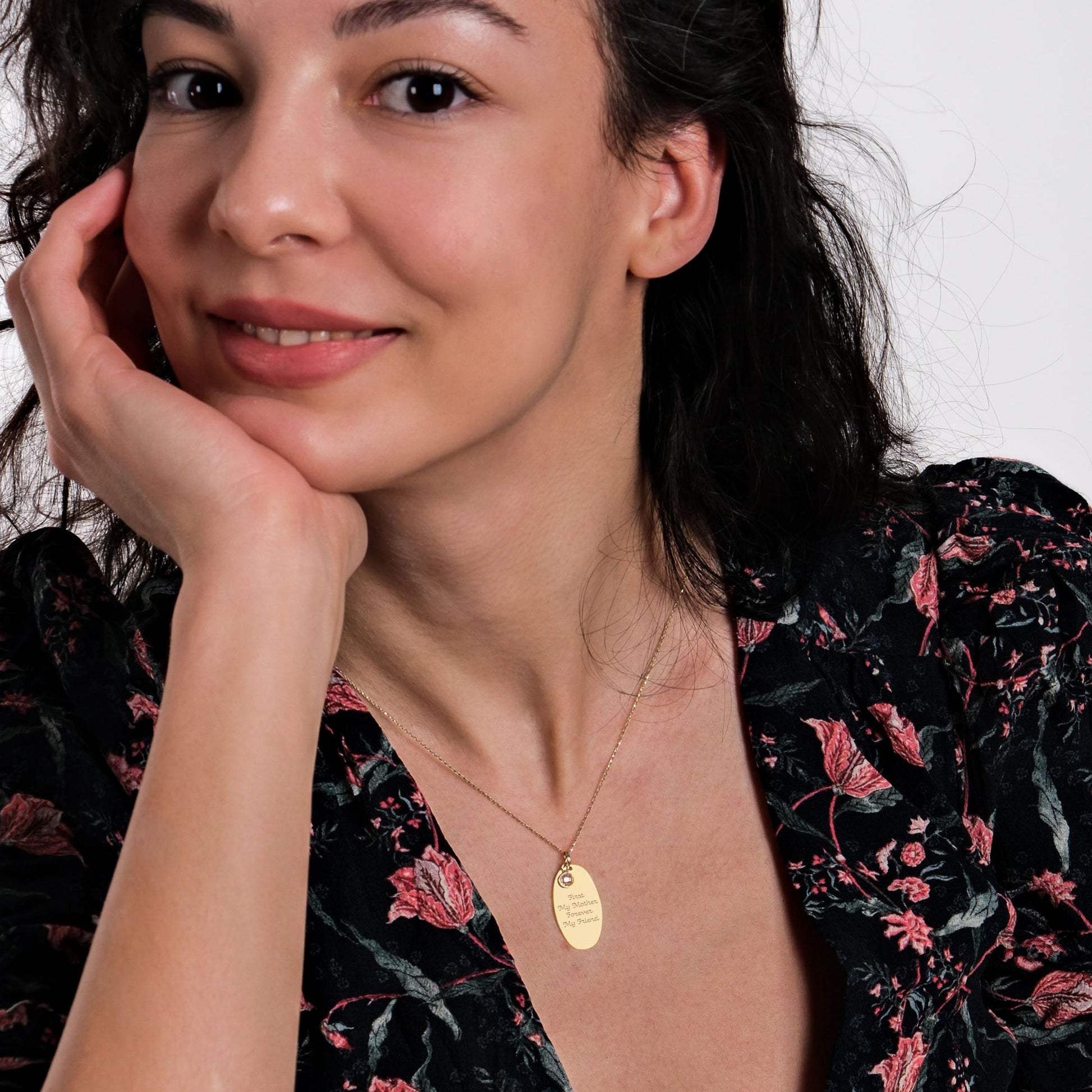A close-up of the necklace’s engraving, focusing on the meaningful message and fine craftsmanship.