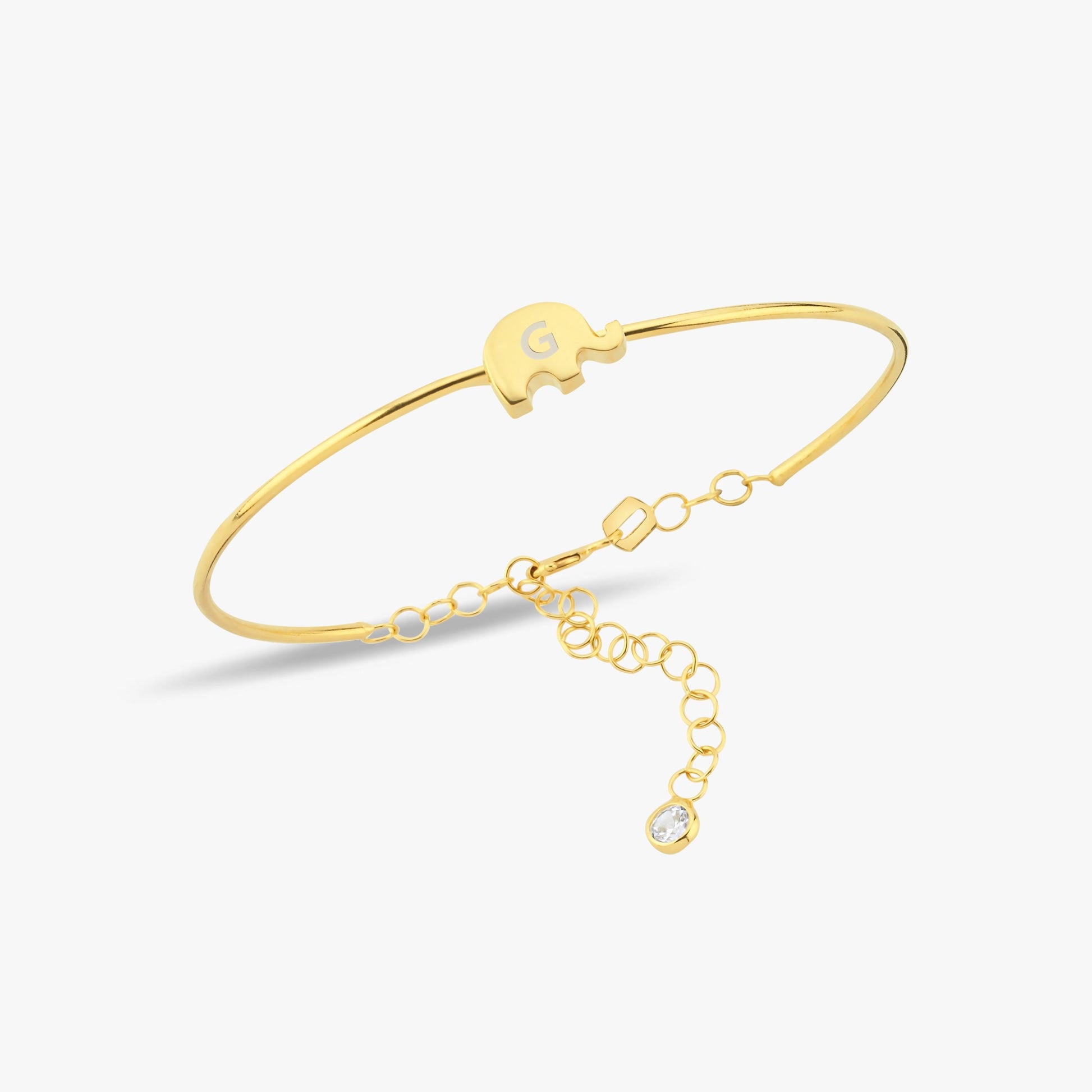 A sleek and dainty gold bracelet shining subtly on the model’s wrist.