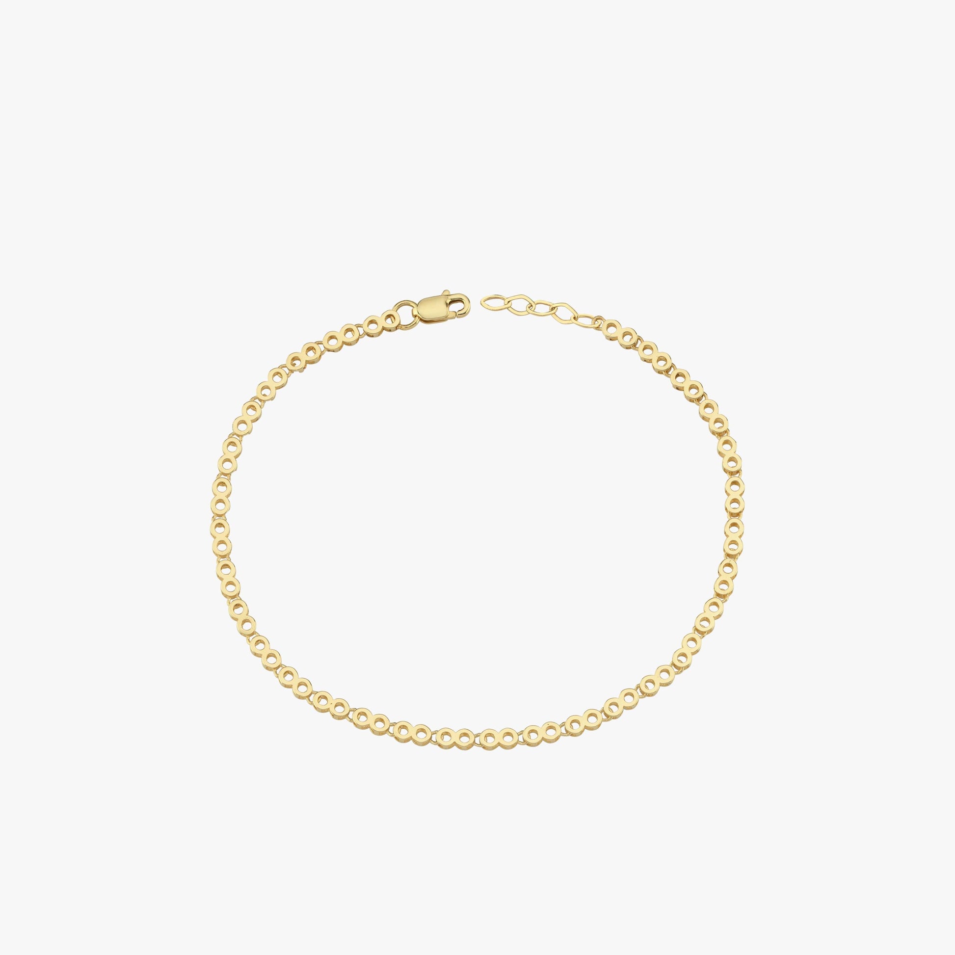 A 14K gold chain bracelet laid flat on a white background, emphasizing its intricate links.