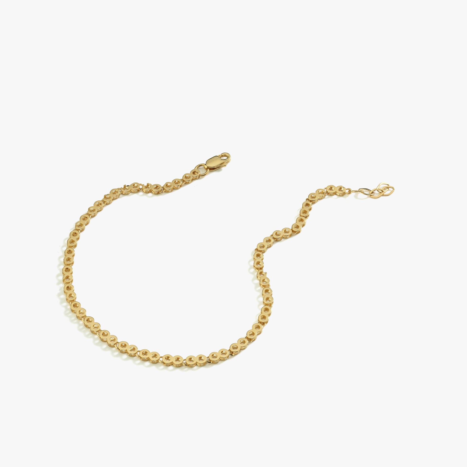 A 14K gold chain bracelet displayed against a white background, highlighting its delicate design.