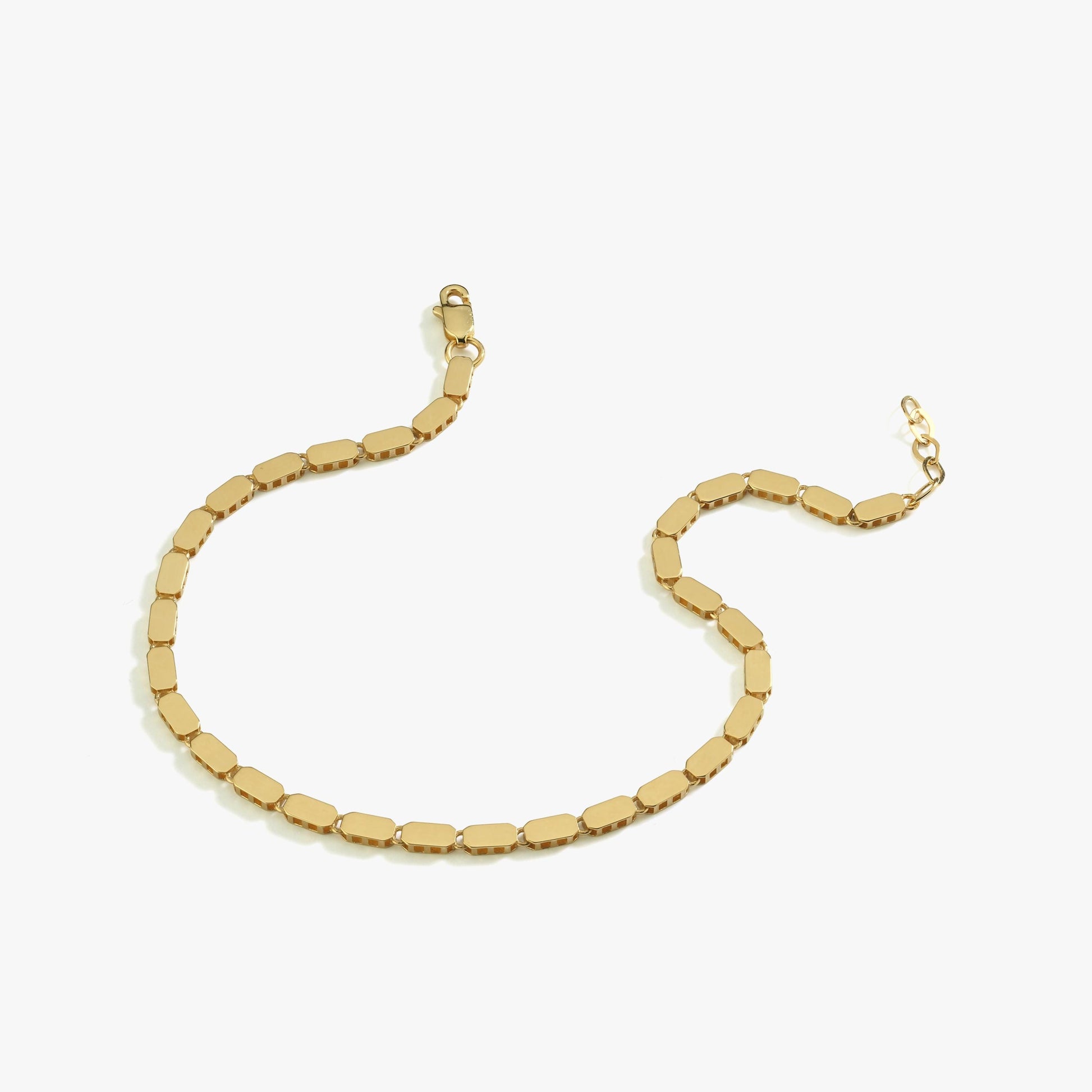 A 14K gold mirror chain bracelet displayed on a white background, showcasing its elegant and polished design.