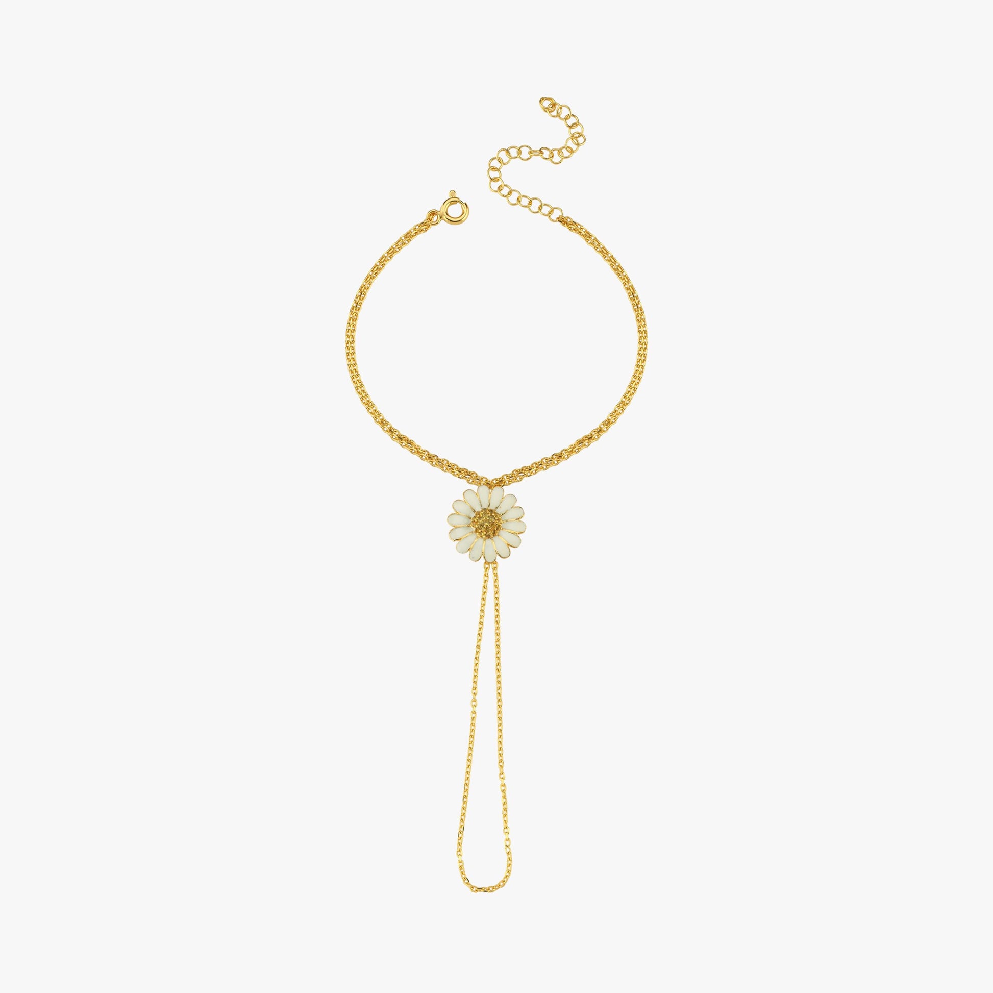 A detailed shot highlighting the white enamel daisy pendant with a gold center, adding a touch of nature-inspired elegance.