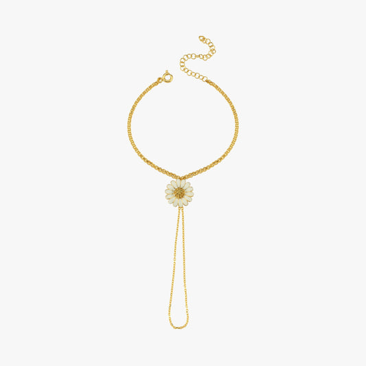 A detailed shot highlighting the white enamel daisy pendant with a gold center, adding a touch of nature-inspired elegance.