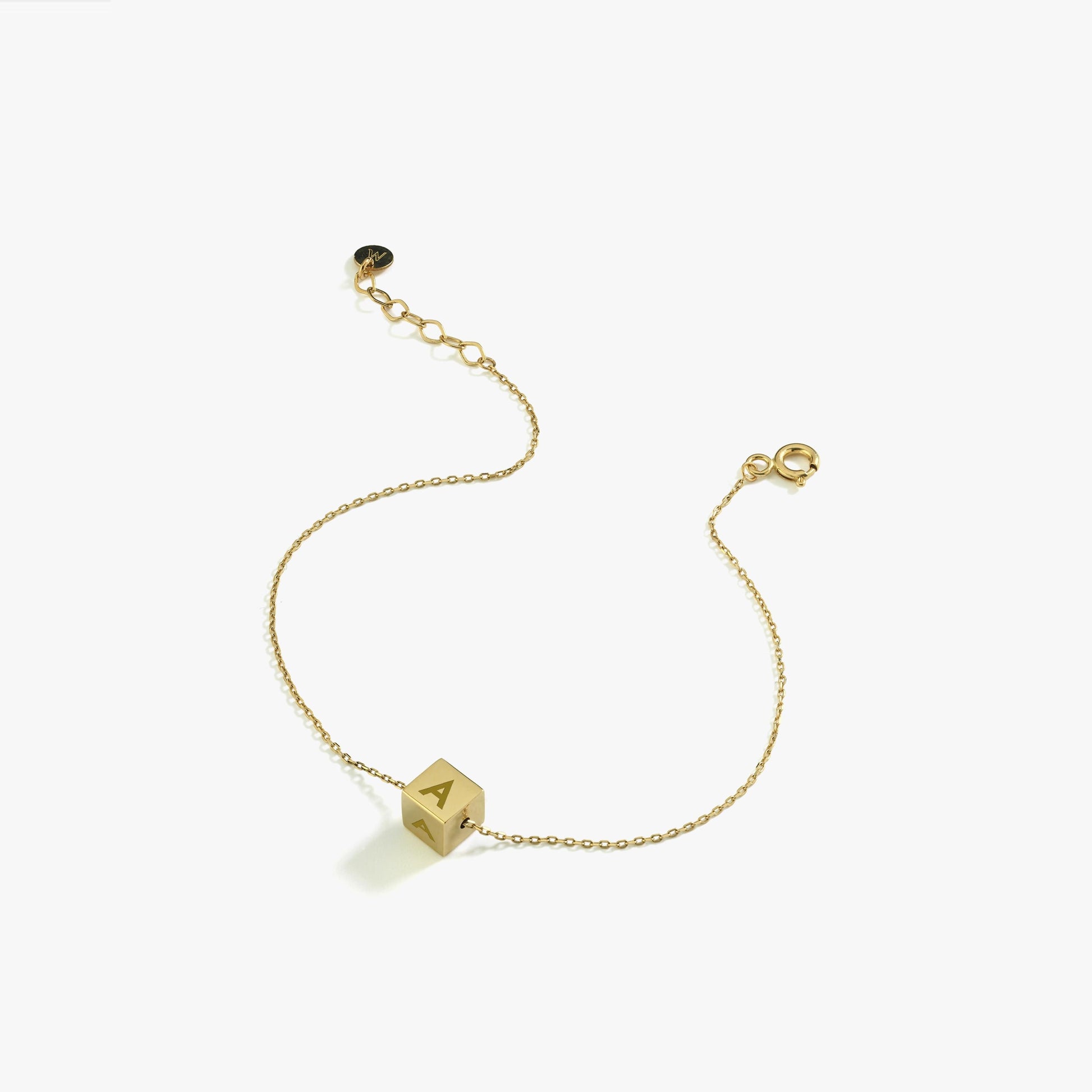 14K Solid Gold Cube Initial Bracelet – A dainty gold bracelet featuring a cube charm engraved with the letter "A."