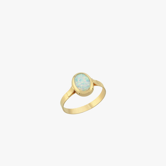 Isolated product image of a 14K solid gold white opal ring with an oval-shaped gemstone and sleek minimalist band on a white background.