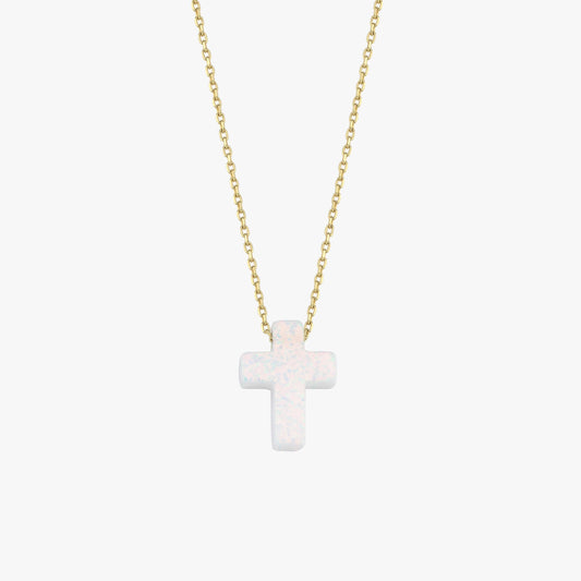 Minimalist studio view of a 14K solid gold necklace with a polished white opal cross pendant, centered on white.