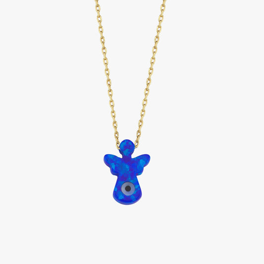 The 14K solid gold lucky symbol necklace with blue evil eye pendant rests on beige fabric, capturing its refined craftsmanship.