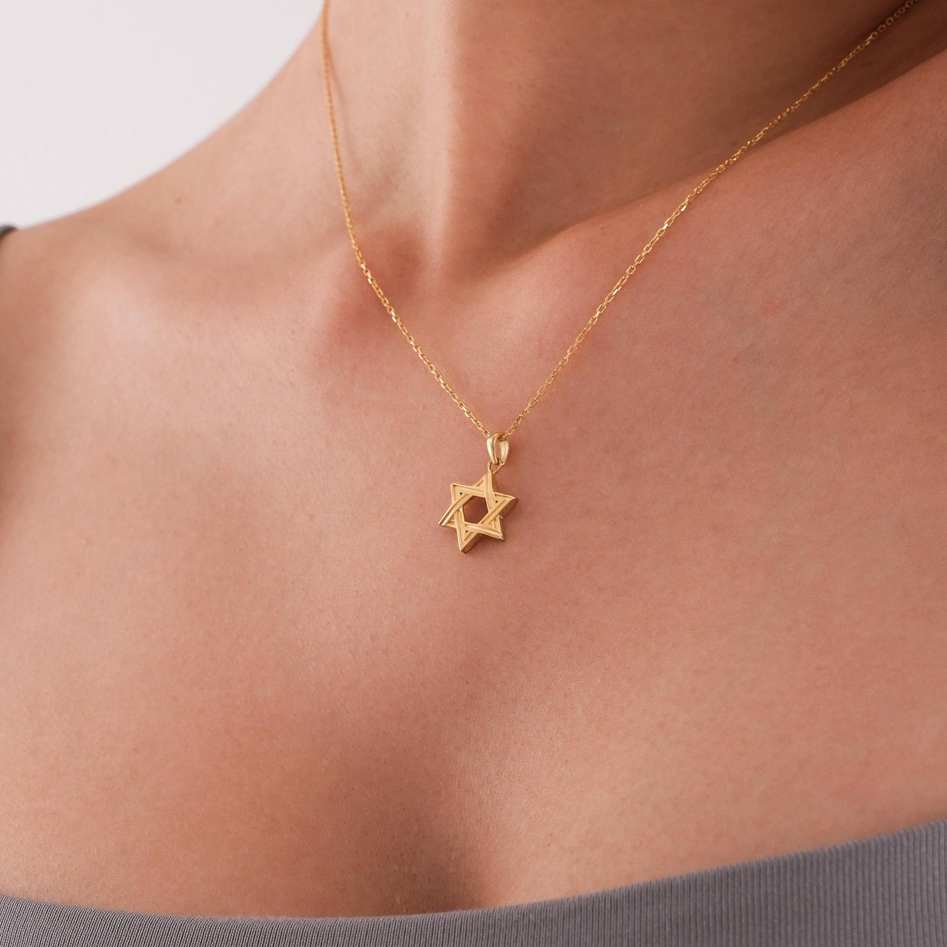 14K Solid Gold Magen David Necklace centered on plain background.