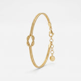 Gold love knot bracelet in 14K gold vermeil, a double snake chain tied in a knot, with lobster clasp and extender