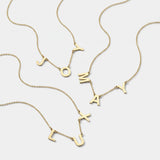 Gold 3 initial necklaces with spaced letter charms on fine chains