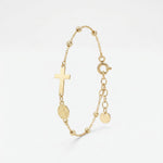 Gold rosary bracelet with a sideways cross and Miraculous Medal of Mary between gold beads, with extender chain