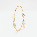 Gold rosary bracelet with a sideways cross and Miraculous Medal of Mary between gold beads, with extender chain