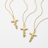Gold cross name necklaces with names written down the cross