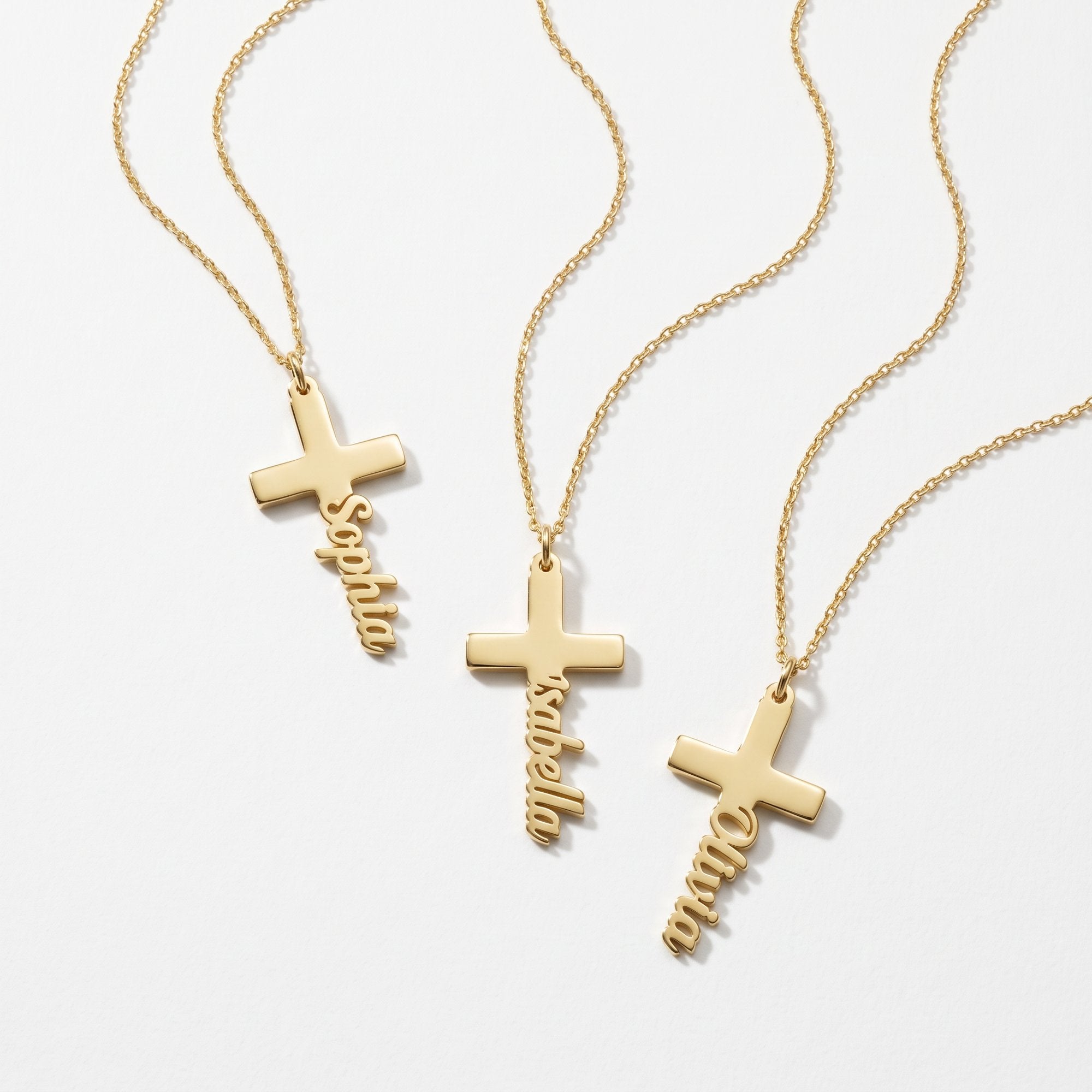Gold cross name necklaces with names written down the cross