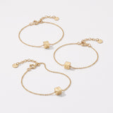 Gold cube initial bracelets with engraved letter cubes on dainty chains