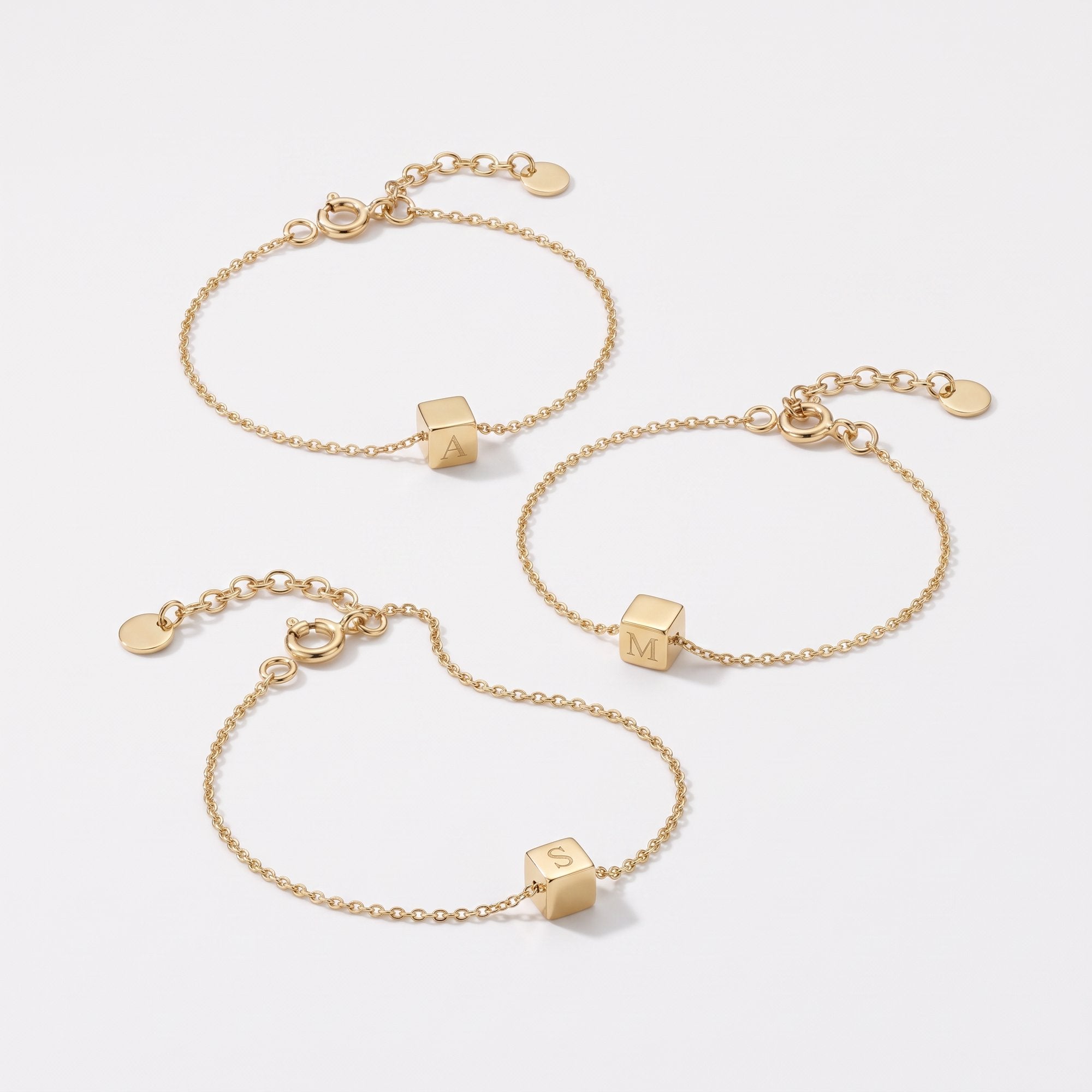 Gold cube initial bracelets with engraved letter cubes on dainty chains
