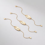 Custom engraved gold bracelets with oval name plates