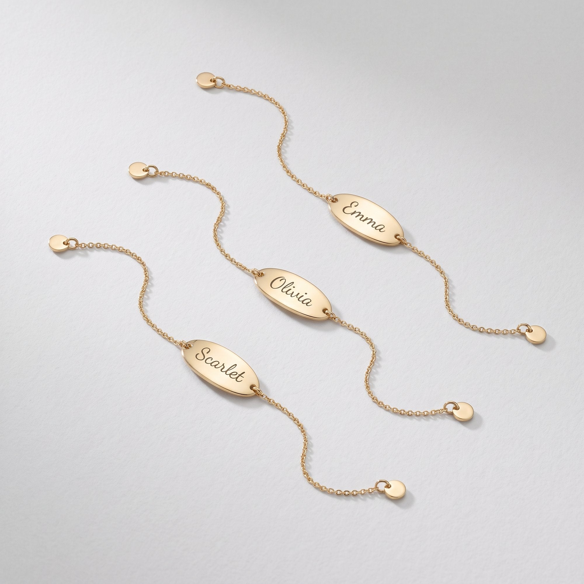 Custom engraved gold bracelets with oval name plates