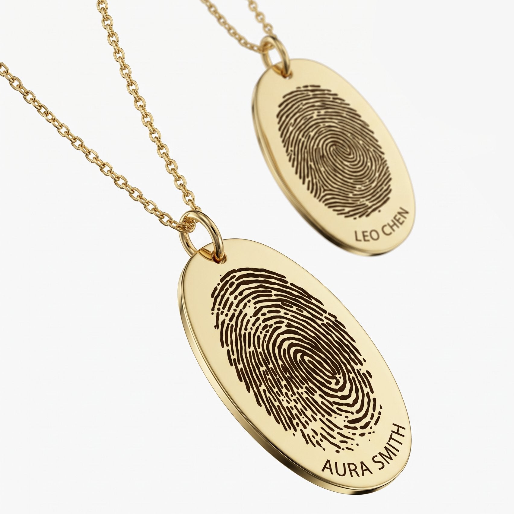 Custom gold fingerprint necklaces with engraved oval pendants and names