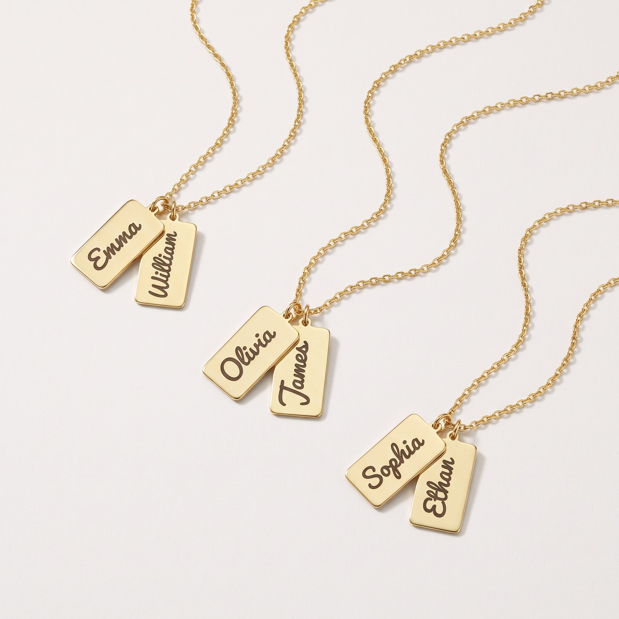 Gold multiple bar name necklaces with two engraved name tags