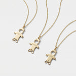 Personalized gold family necklaces with engraved boy charms named Lucas, Mateo and Leo