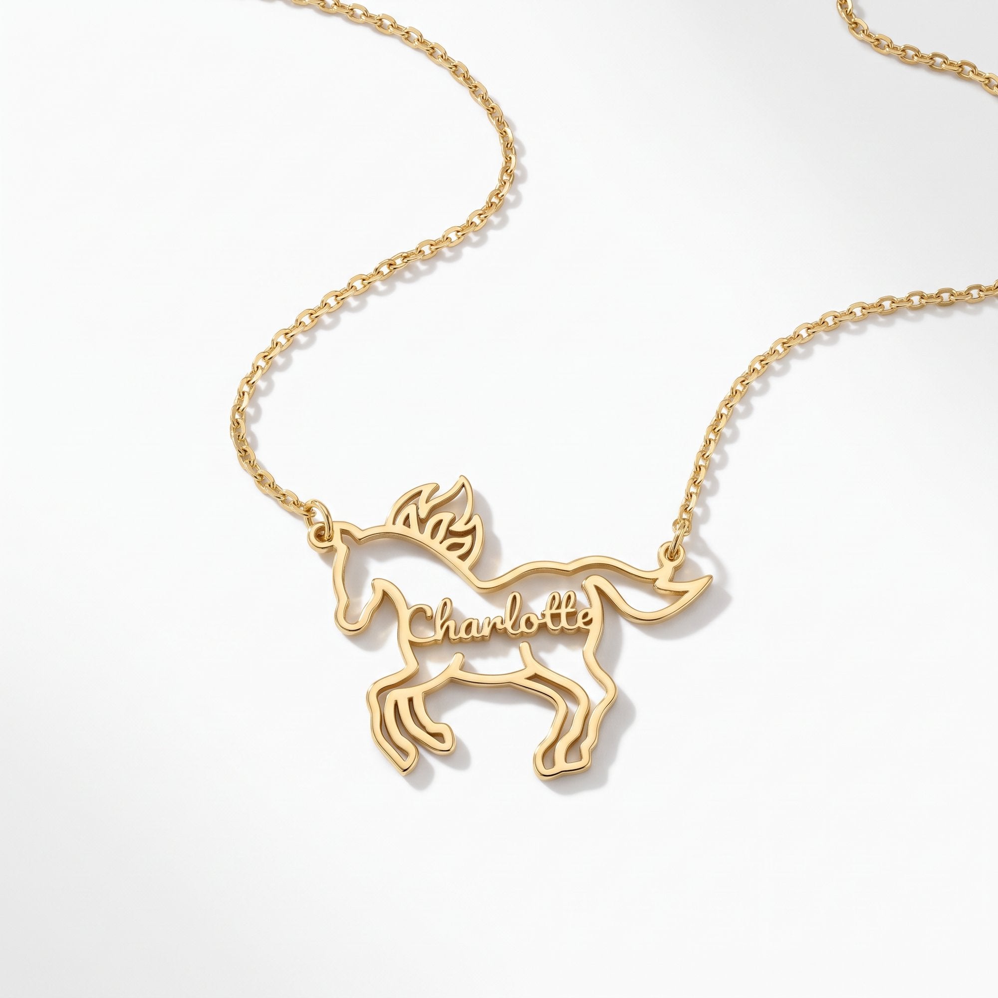 Personalized gold fire horse name necklace with Charlotte inside the horse outline