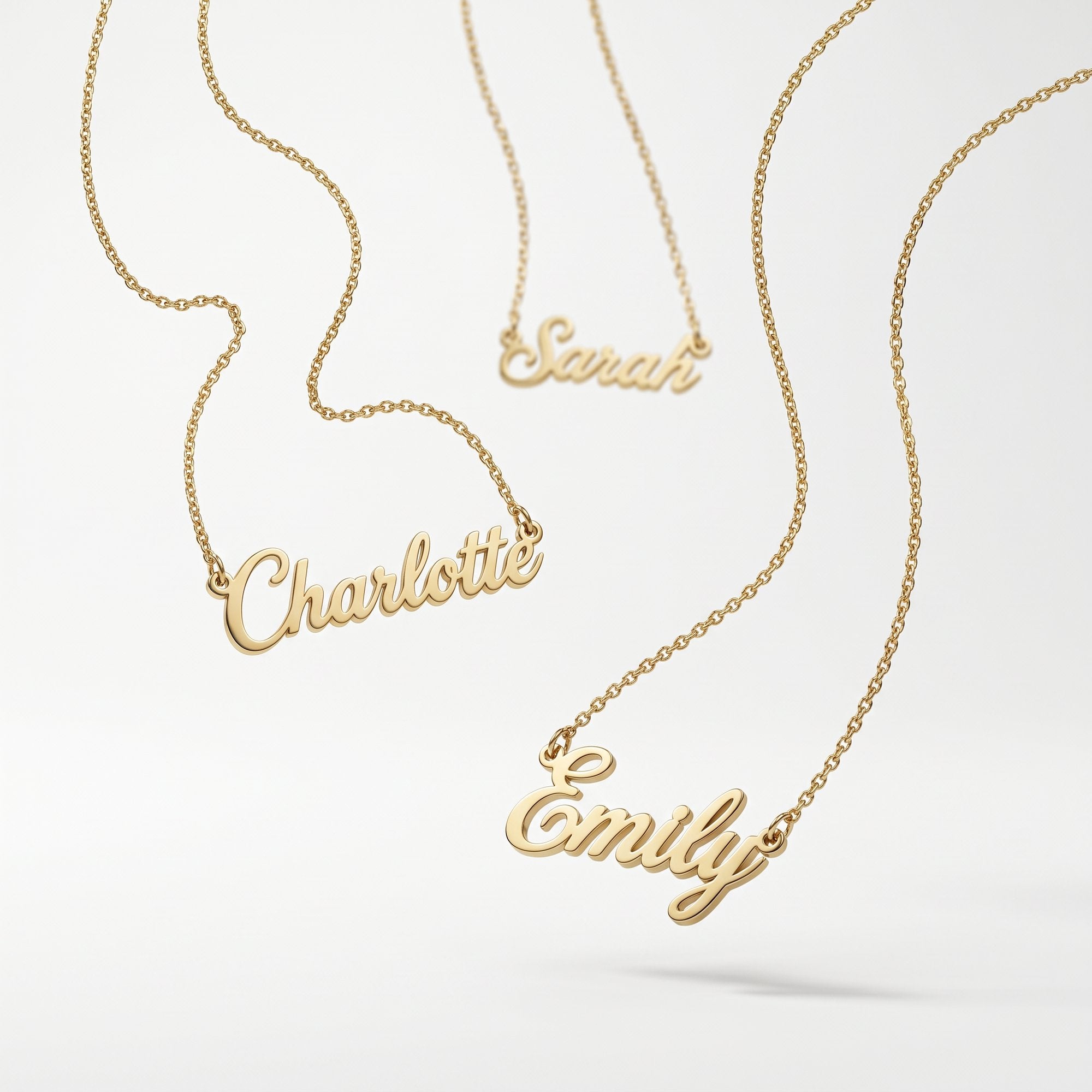 Gold script name necklaces spelling Sarah, Charlotte and Emily