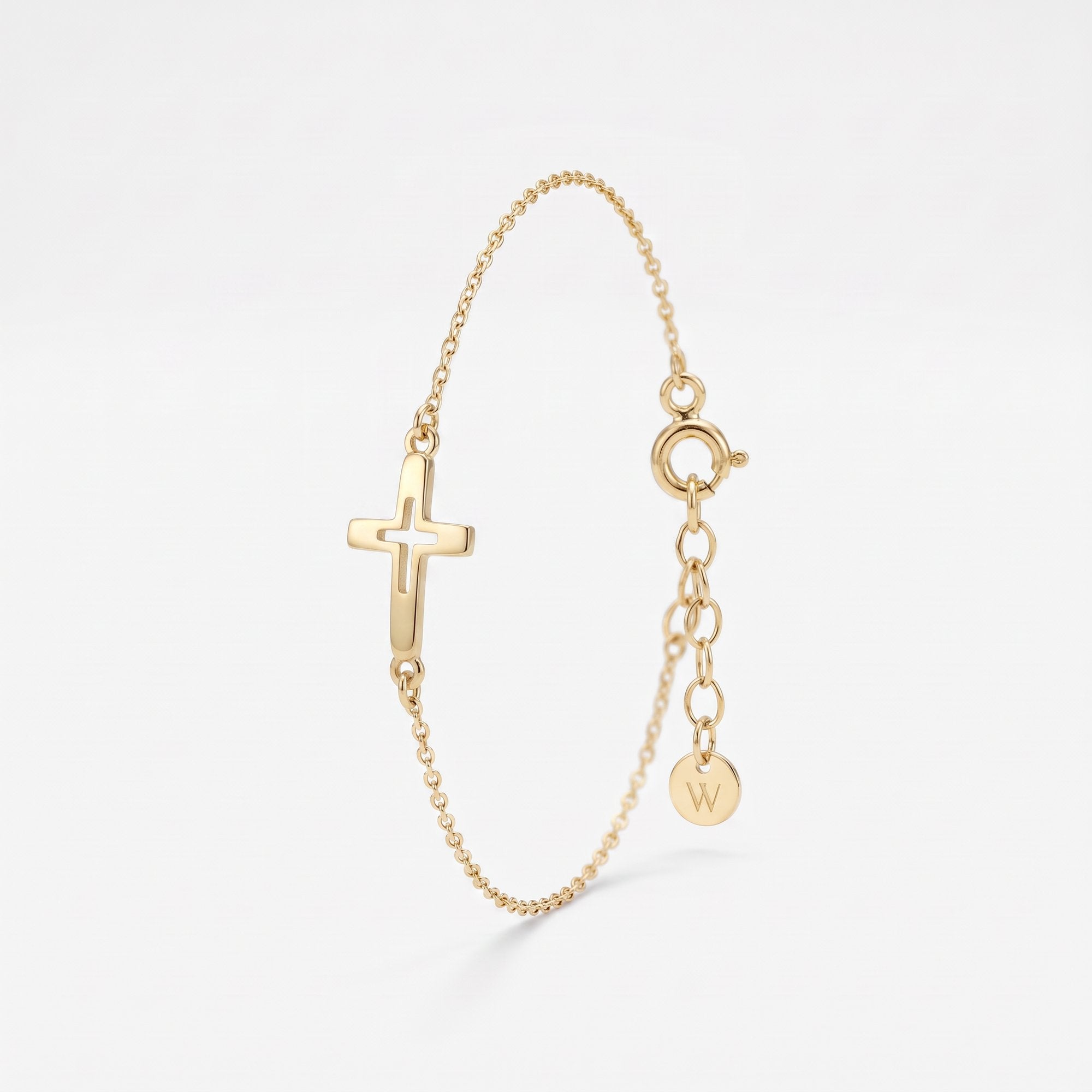 Gold sideways cross bracelet with a cut-out center cross on a dainty cable chain, a Christian cross bracelet with extender