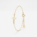 Gold sideways cross bracelet with a cut-out center cross on a dainty cable chain, a Christian cross bracelet with extender