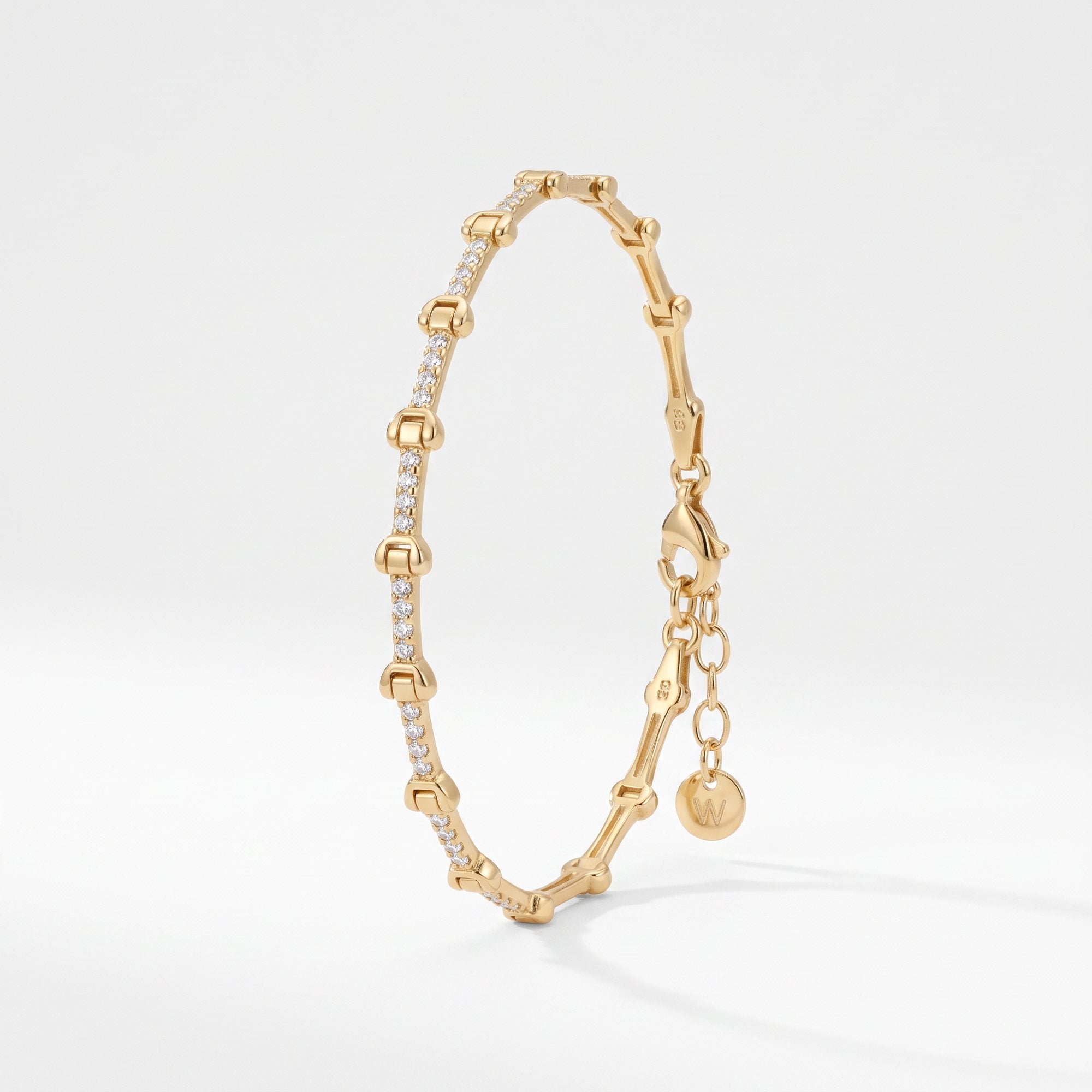 Gold bone bracelet with bone shaped links and cubic zirconia bars, a skeleton chain bracelet in 18K gold vermeil