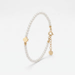 Gold four leaf clover bracelet with dainty pearls, a lucky clover charm on a pearl bracelet in 18K gold vermeil