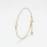 Gold four leaf clover bracelet with dainty pearls, a lucky clover charm on a pearl bracelet in 18K gold vermeil