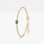 Emerald tennis bracelet in 18K gold vermeil, an emerald cut green stone in a bezel setting on a sparkling tennis chain