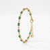 Emerald tennis bracelet in 18K gold vermeil with bezel-set emerald green baguette stones and small clear stones, with extender