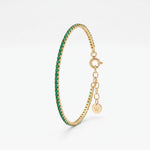 Dainty emerald tennis bracelet in 18K gold vermeil, a row of round green stones in prong settings with extender chain