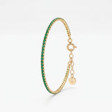 Dainty emerald tennis bracelet in 18K gold vermeil, a row of round green stones in prong settings with extender chain