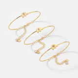 Gold elephant bangle bracelets with custom initials and birthstone charms