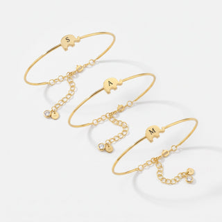 Gold elephant bangle bracelets with custom initials and birthstone charms