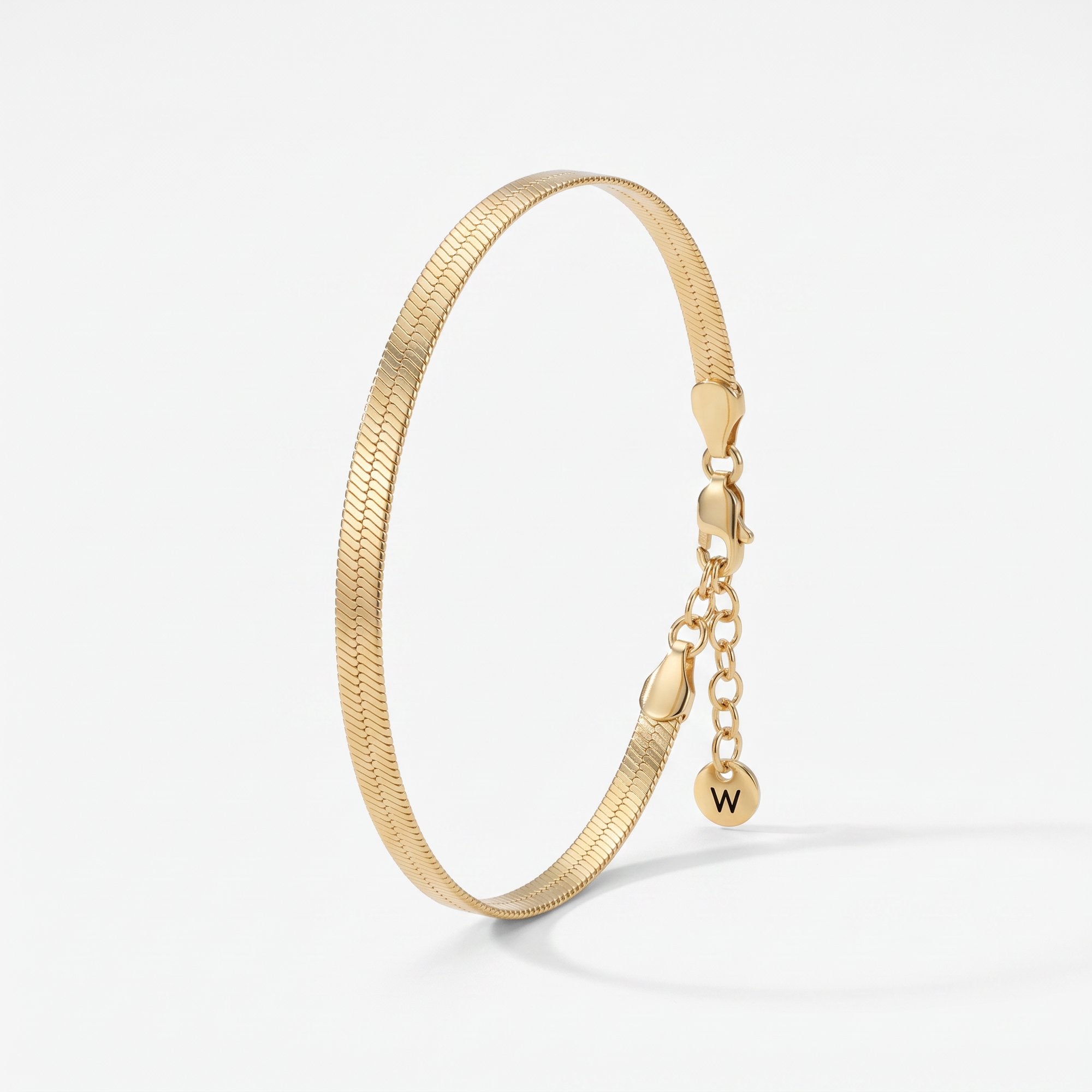 Gold herringbone bracelet, a flat snake chain bracelet in 18K gold vermeil with lobster clasp and extender