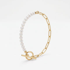Gold paperclip bracelet with a half pearl strand and half paperclip chain, a toggle bracelet in 18K gold vermeil