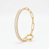 Gold paperclip bracelet with a baguette tennis section, half tennis half paperclip chain with a statement monster lock clasp