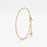 Gold pearl station bracelet in 18K gold vermeil, dainty pearls spaced along a figaro link chain with extender