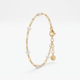 Gold pearl station bracelet in 18K gold vermeil, dainty pearls spaced along a figaro link chain with extender