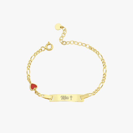Gold baby id bracelet with a name tag and red heart charm on a white background