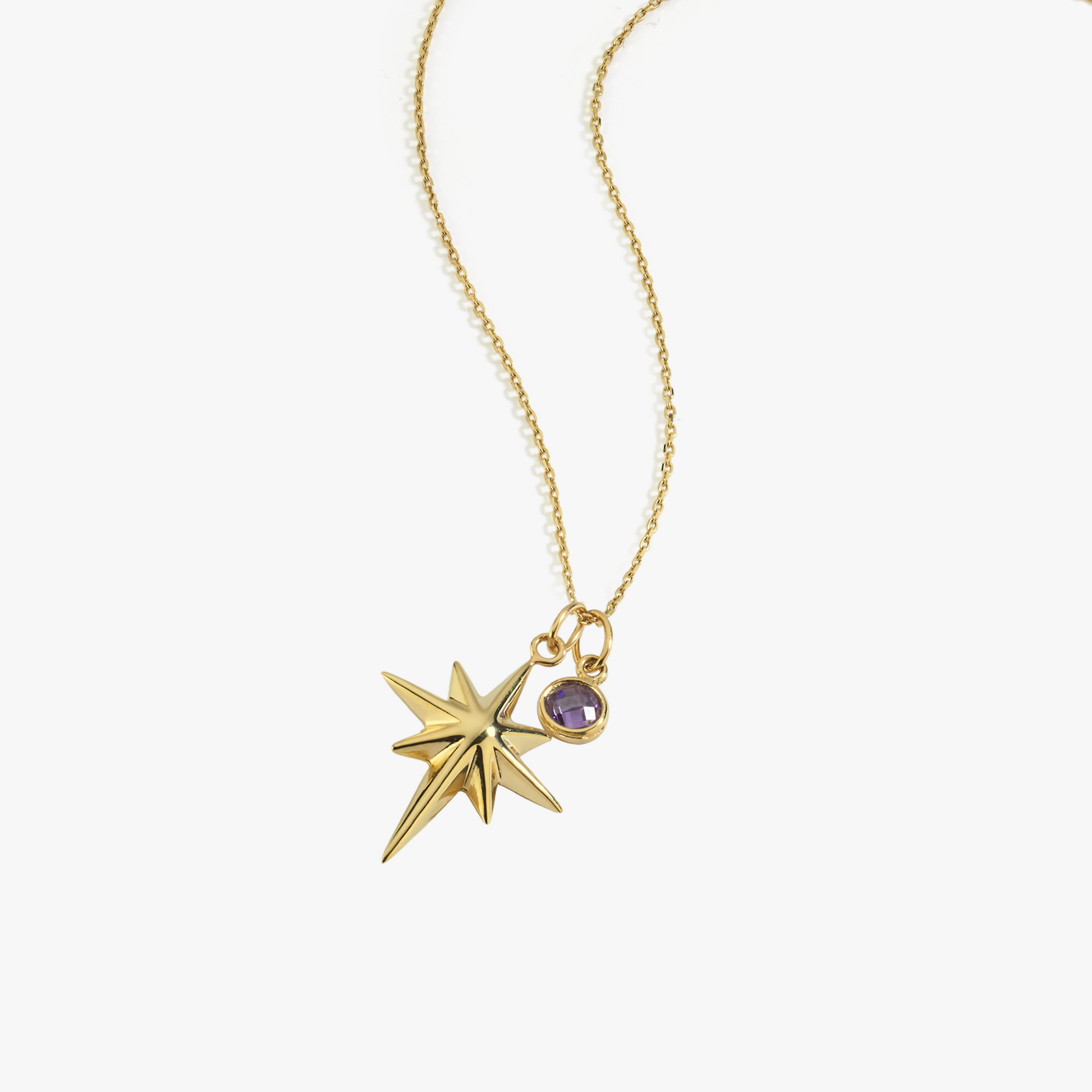 Gold star pendant necklace with purple gemstone, elegant jewelry design on a delicate chain, perfect for gifts.