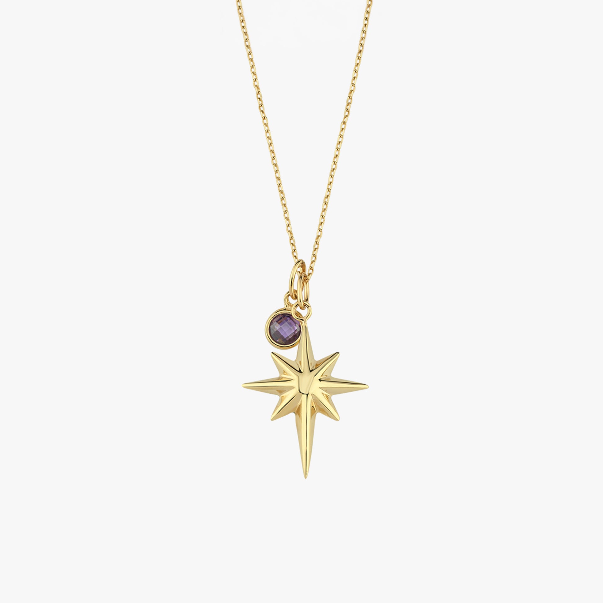 Gold star pendant necklace with purple gemstone charm on delicate chain, elegant jewelry for fashion-forward style.
