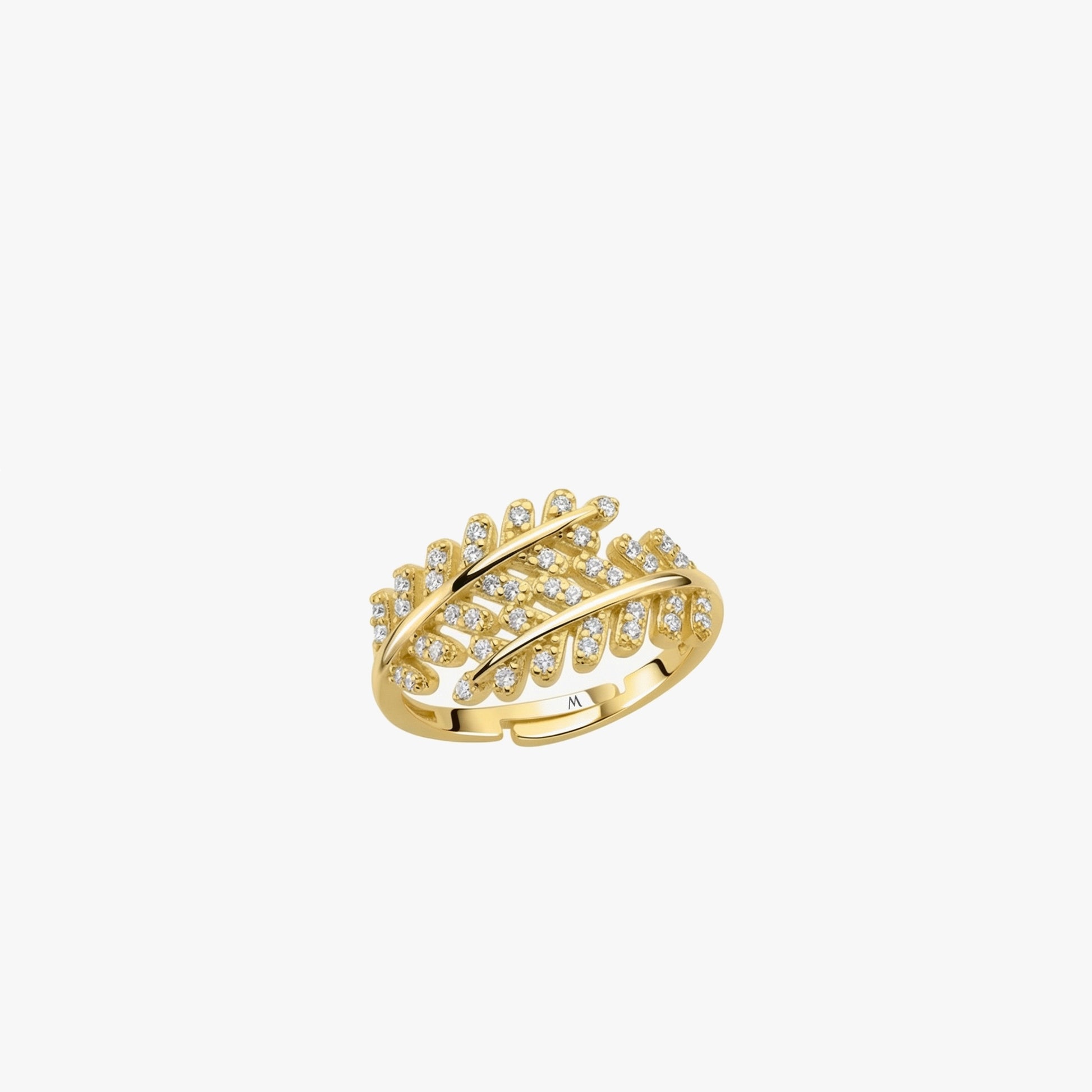 Gold ring with diamond accents on a white background